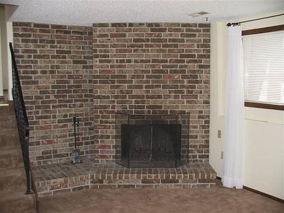 Wonderful Fireplace in Large Carpeted Family Room