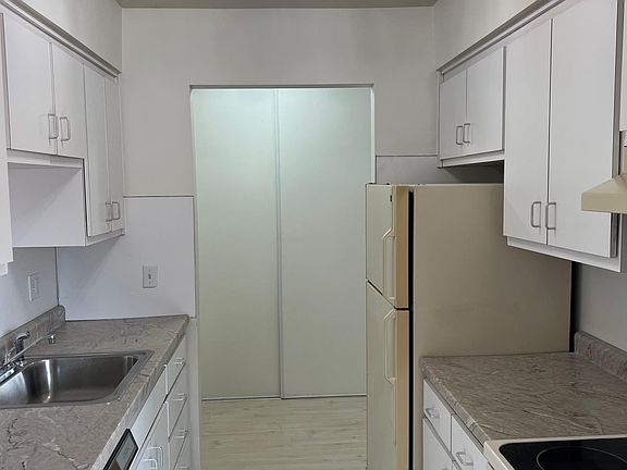 kitchen open to laundry area
