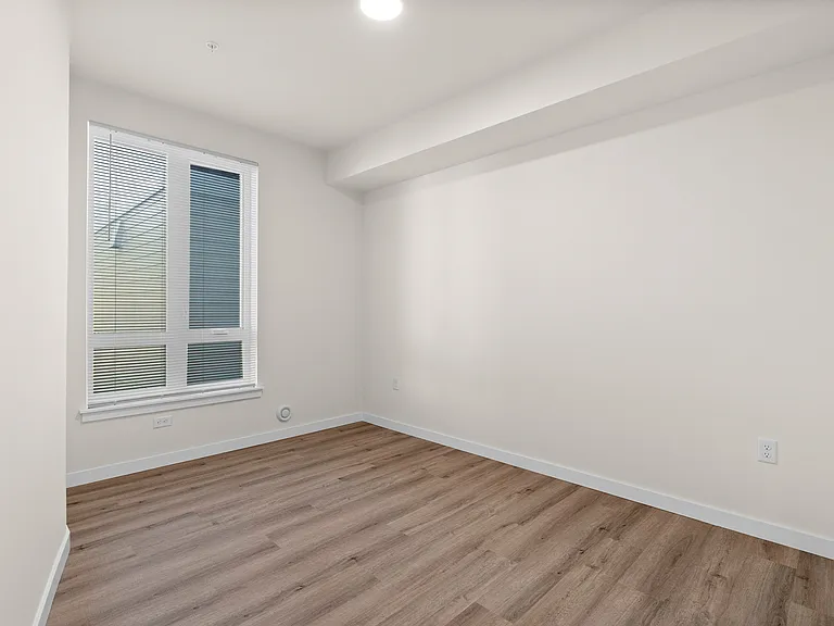 Comfortable bedroom space with natural light. Comfortable bedroom space with natural light.
