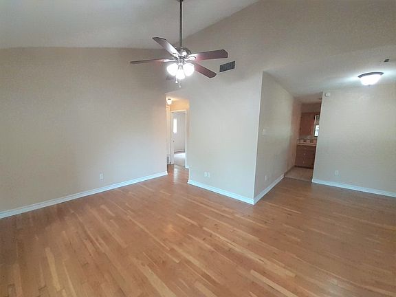 LIVING-DINING ROOMS-VIEW OF KITCHEN & BEDROOM HALLWAY