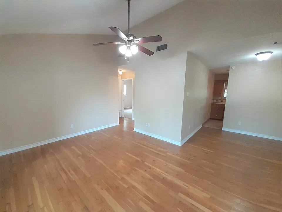 LIVING-DINING ROOMS-VIEW OF KITCHEN & BEDROOM HALLWAY