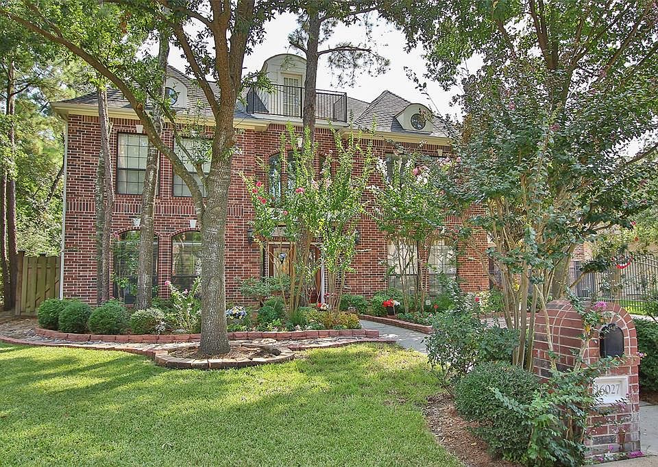 CUSTOM LANDSCAPING DETAIL AND STONE WALKWAY - Beautiful landscaping accents the rich colored brick elevation of this custom home by Partners in Building. Fabulous updates will be seen throughout!