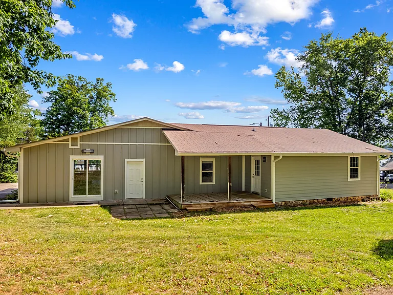 Covered porch. Large storage area through the white door.