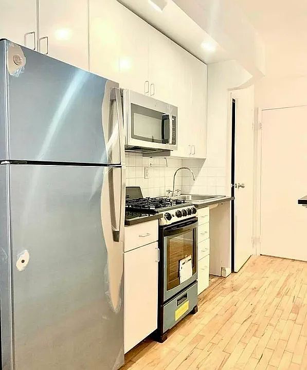 1st image of 319 E 8th St APT 2B