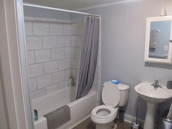 new toilet,new tub,new tile,pedestal sink