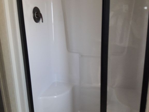 Easy access stand up shower w built in seats