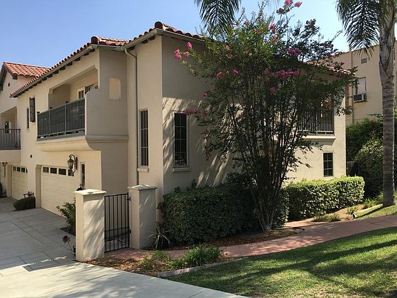 Outside front view showing 2 car attached garage
