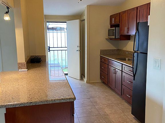 Kitchen with full size refrigerator