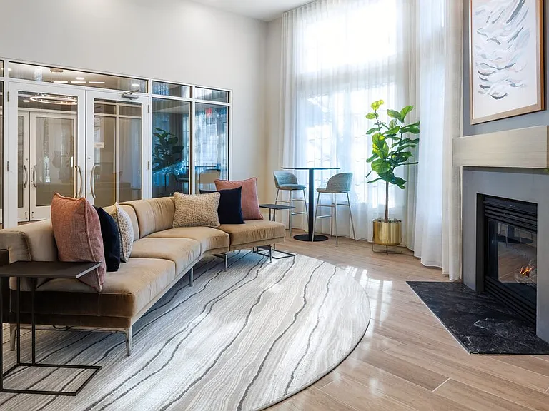 Resident lounge with seating area and fireplace