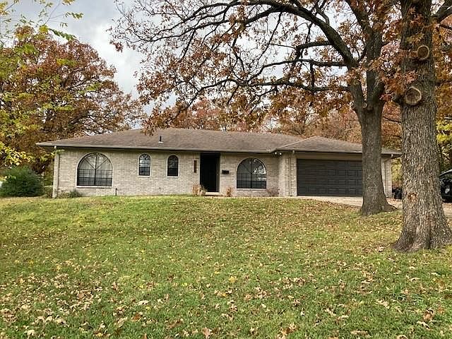 Front of house, half-acre lot