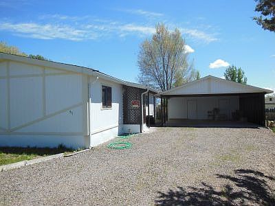 2-Car Carport w/shop & graveled Driveway
