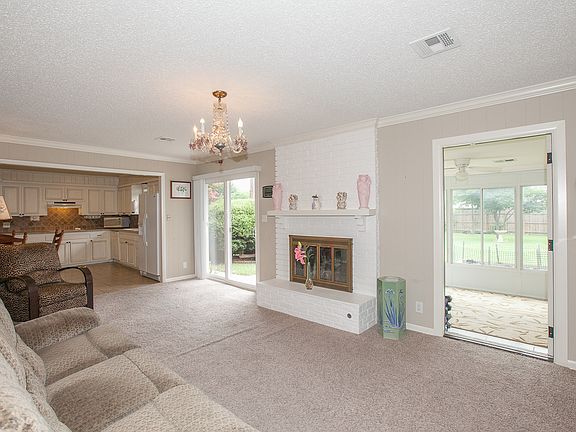 Den leads to sunroom