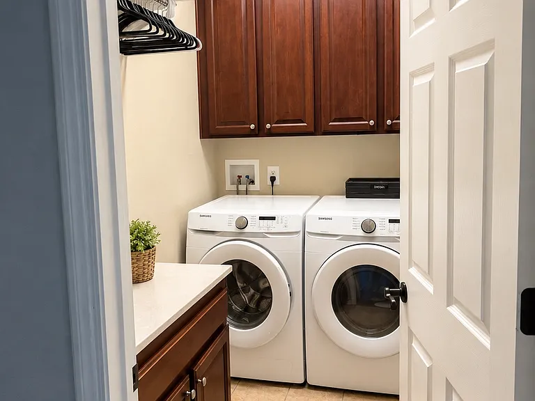 laundry room with washer and dryer and plenty of stroage cabinets