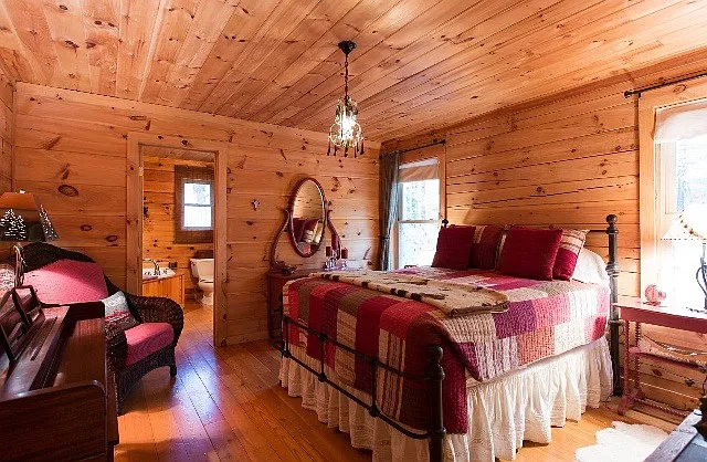 Master bedroom with piano and Sundance chandelier.