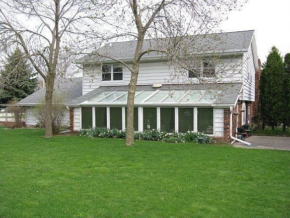 Rear of house with sunroom