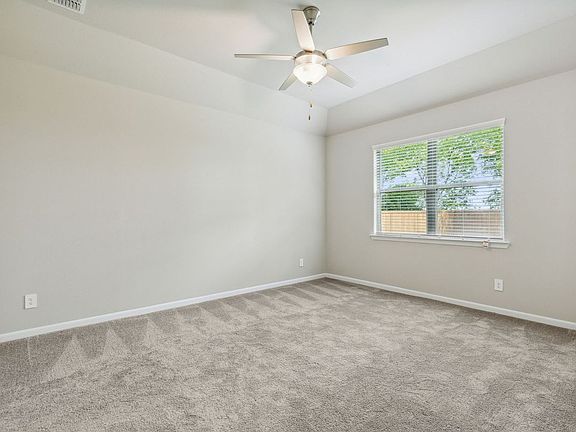 Primary Suite in the Pearl home plan by Trophy Signature Homes - REPRESENTATIVE PHOTO