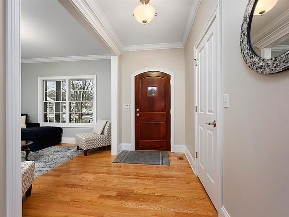 Nice foyer with open staircase and guest closet