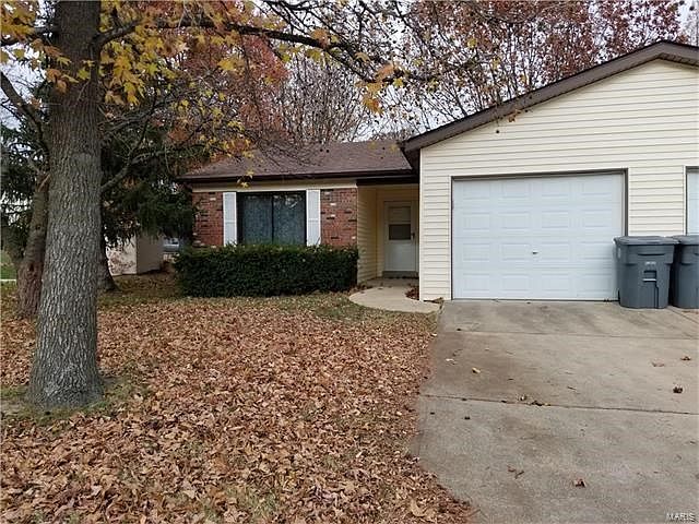 Front of duplex -- oversized 1-car garage.