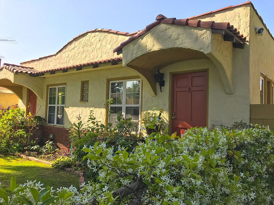 Fenced in front private front yard on quiet pine tree lined street