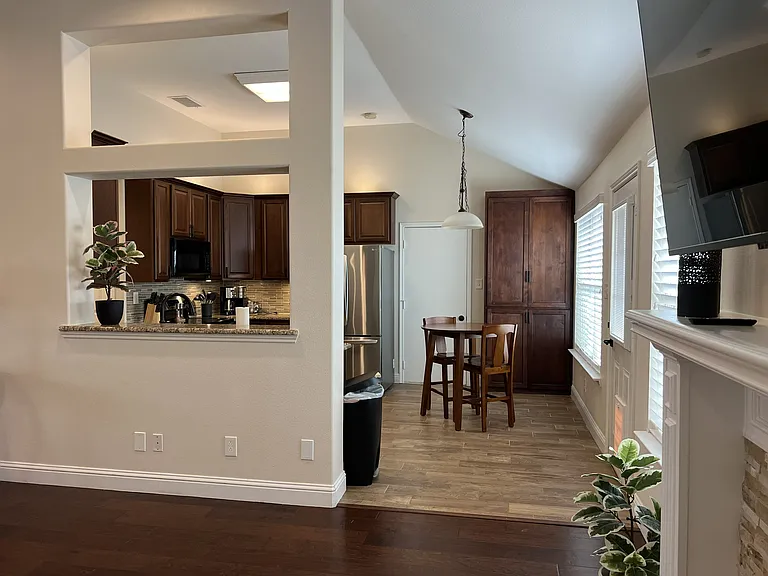 Seamless open floor plan connecting the living, dining, and kitchen spaces.