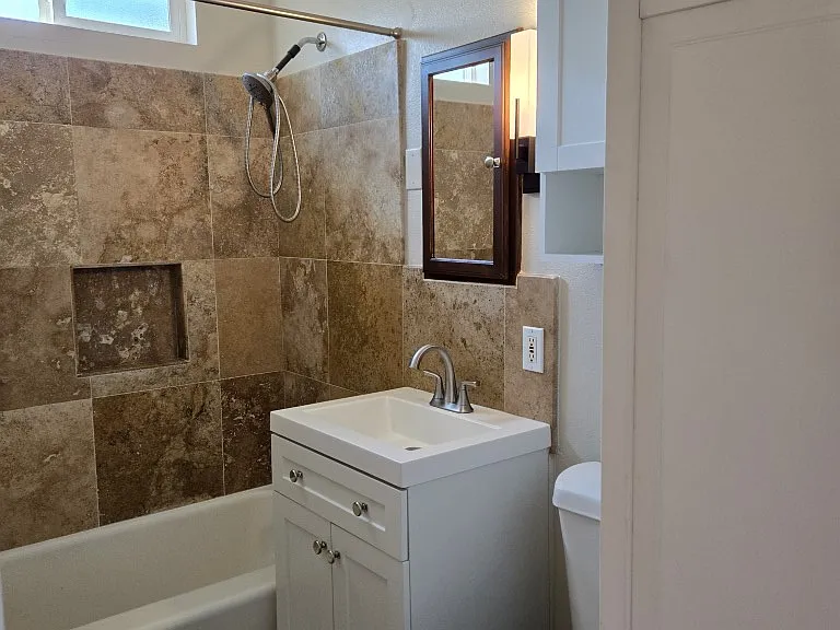 Restroom with Travertine Tiles