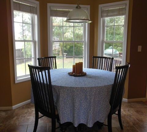 BREAKFAST NOOK W/ BAY WINDOW & VIEW OF THE YARD 