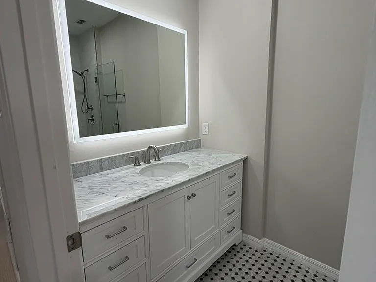 Upstairs second bathroom with lighted mirror