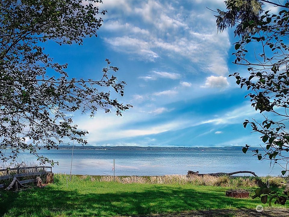Views of the bay across the road from the lot for sale in this listing>