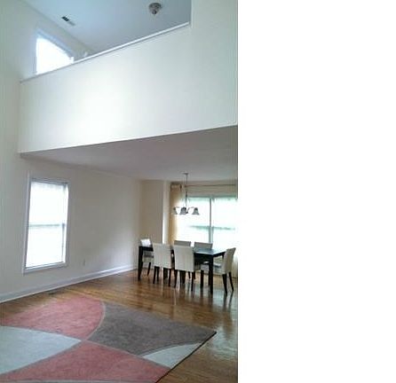 Open living Room with vault ceiling and Dinning room