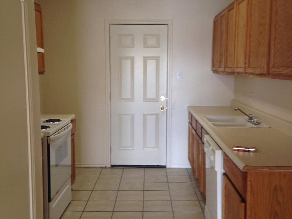 Galley Kitchen w door to yard