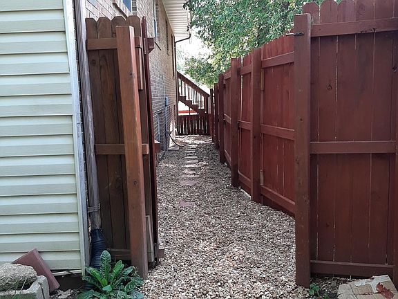 Dog run from front of house to back yard.