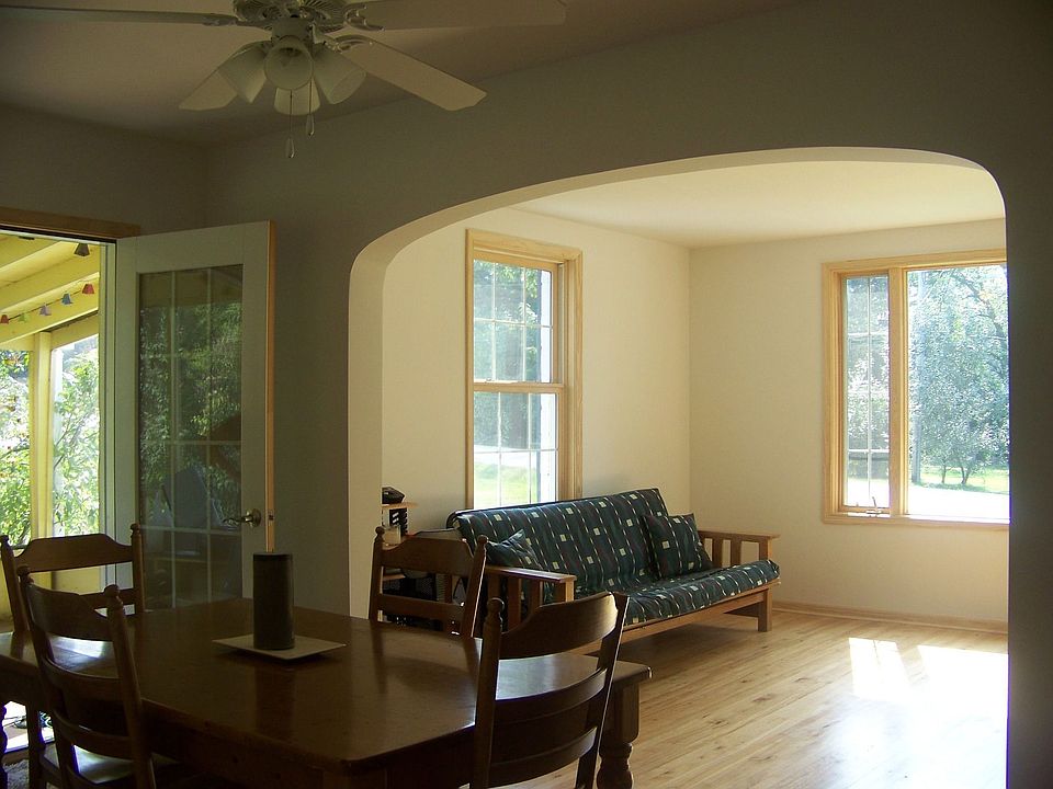 Living rm with new windows and drywall