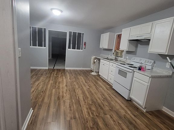 HUGE kitchen. A dream for any cook. New appliances, abundant cabinets & counters, and room for a full-size table or island. Prepare & Enjoy meals for the family or friends. Laundry/Storage room included