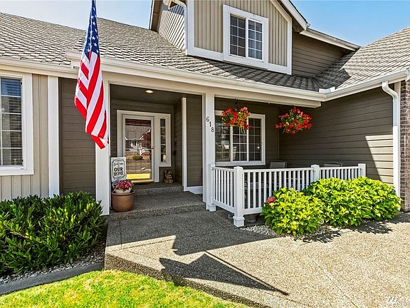 Sit out on your front porch and enjoy the fantastic neighborhood you get to live in! Look under the plants under the flag, those curbs are all over this property! 