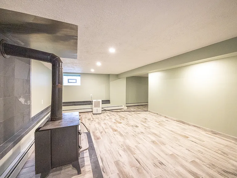 Finished basement with wood burning fire place