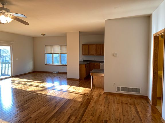 Half bath to right. Living area open to kitchen and dining.