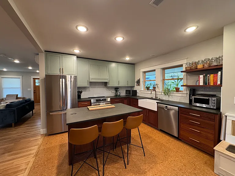 Open concept kitchen with island and custom cabinets
