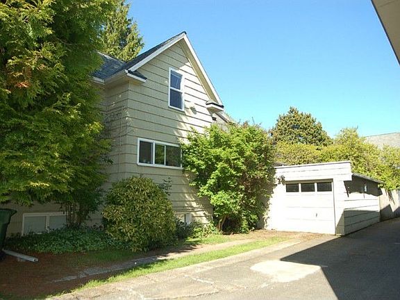 Parking for 2 and a garage. Garage belongs to the main floor unit #1. Rear garage access goes to rear yard and porch for unit #1. New Siding on South wall, and roofing of house and garage installed 2010.