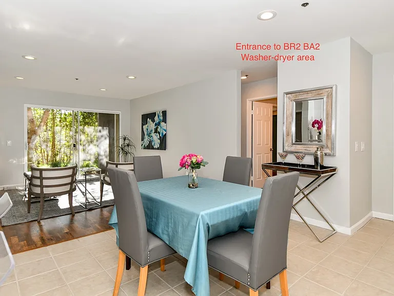 Living and dining area with view of bedrooms