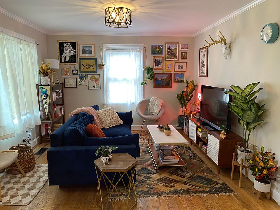 Bright, open living room with large picture window. Hardwoods throughout. Lots of light and windows.