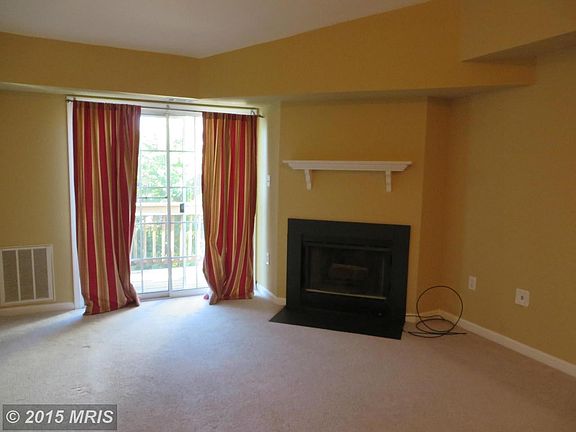 LIVING ROOM WITH WOOD BURNING FIREPLACE