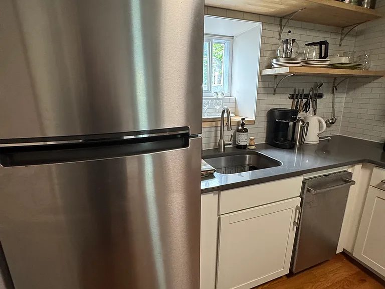 Kitchen with above shelving.