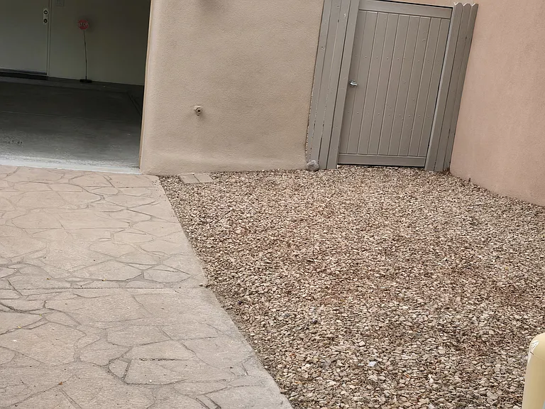 Backyard access in the front with a locked gate