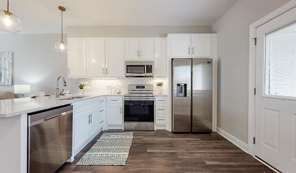 Kitchen equipped with all 4 appliances: Fridge, Range, Dishwasher, Microwave. And has Garbage Disposal