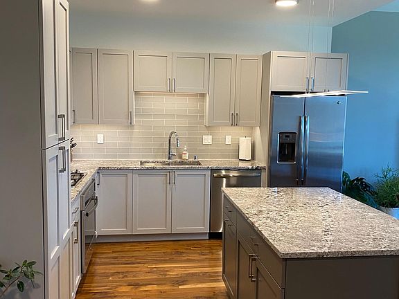 Kitchen - newly replaced cabinets; island faces the view