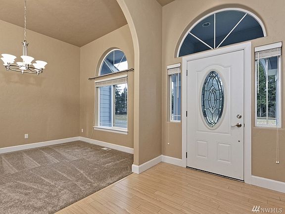 The front door, and the dining room. To the right is a formal living room, and then the regular living room and kitchen are straight ahead... 