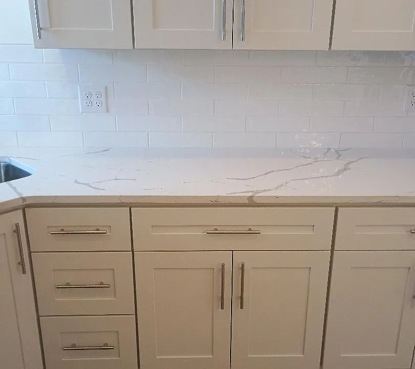kitchen area with ample cabinets with granite countertops
