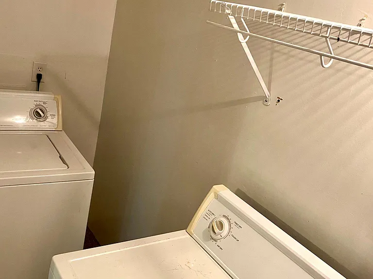 Washer and dryer (more storage space on other end of room, not pictured).
