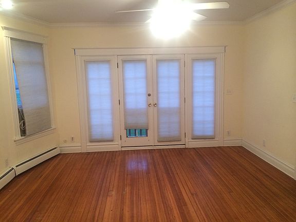 Formal living room with bay windows and hard wood floors
