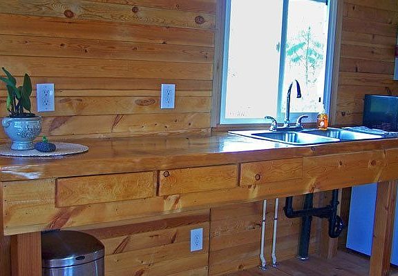 Solid wood kitchen counter with solid wood drawers.
